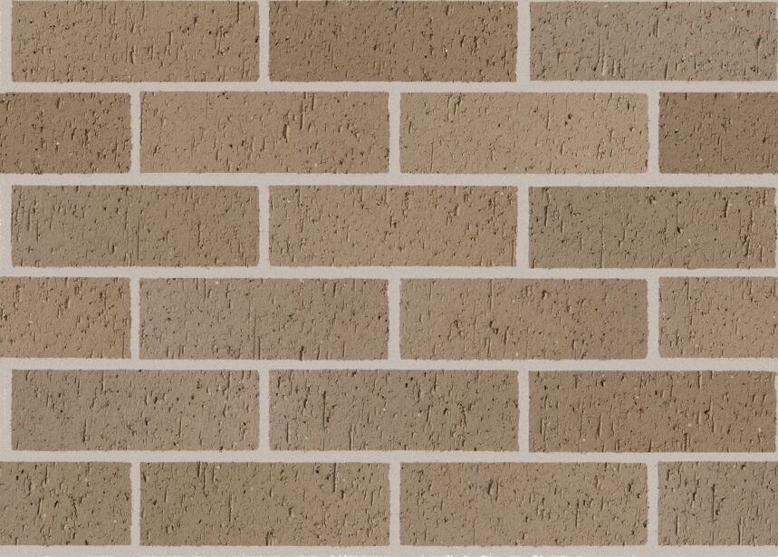 A wall constructed using the Whitsunday Brampton bricks, featuring a blend of light brown and tan tones reminiscent of the peaceful Whitsunday sands. These rectangular bricks are laid horizontally with consistent white mortar separating them. The surface has a rough, slightly uneven texture that captures an organic charm similar to the natural beauty of Brampton Island.