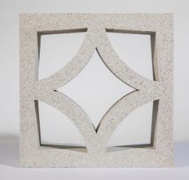 The Breeze Block Solid Grey is a square geometric piece showcasing a symmetrical diamond design that forms four curved triangular cutouts. This unique block stands out beautifully against a plain white background.