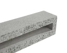 A close-up of the GB Breeze Blocks Linear Nickel, a rectangular, hollow concrete block with a rough, speckled surface, displayed against a white background.
