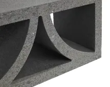 Close-up of a GB Breeze Blocks Arc Pewter in dark grey concrete, featuring two large rectangular openings and a curved diagonal divider for an arch-like design.