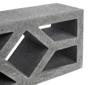 A close-up of a dark grey GB Breeze Blocks Diamond Pewter with rectangular and diamond-shaped hollow sections, set against a white background.