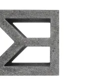 Close-up of a gray GB Breeze Blocks Arc Pottery with geometric cutouts, partially visible on the left side of a white background.