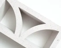 A close-up of the GB Breeze Blocks Arc Pottery, a white rectangular block with two curved-edge triangular cutouts, set against a white background.