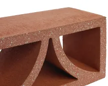 Close-up of GB Breeze Blocks Arc Pottery in reddish-brown, featuring geometric openings and a textured surface, inspired by arc pottery designs, isolated on a white background.
