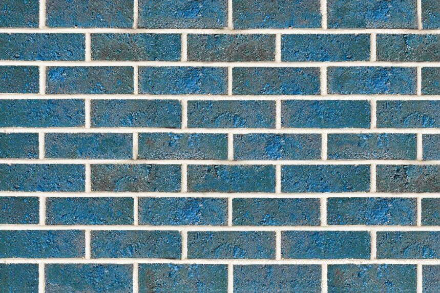 The Laguna product features a pattern of rectangular bricks with a textured, uneven surface in shades of blue. The bricks are arranged in a horizontal, staggered layout with white mortar lines separating them.