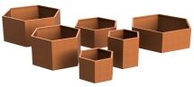 Six brown, hexagonal planters of varying sizes are arranged together on a white background. The planters have a rusty, metallic appearance and are open at the top.