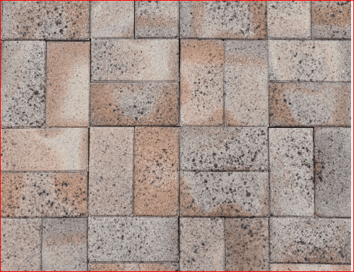A close-up of a Cobble Full Cream brick wall showcases rectangular bricks in a staggered pattern, featuring various shades of brown, beige, and gray. The design includes speckles and weathered textures that add depth to the overall appearance.