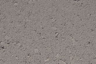A detailed look at the uneven, textured surface of the Broadway Stone, showcasing its small bumps and irregularities.